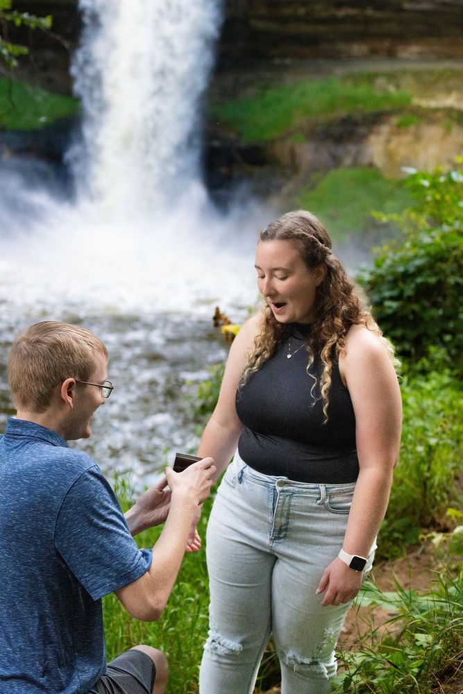 Proposal beside a waterfall
